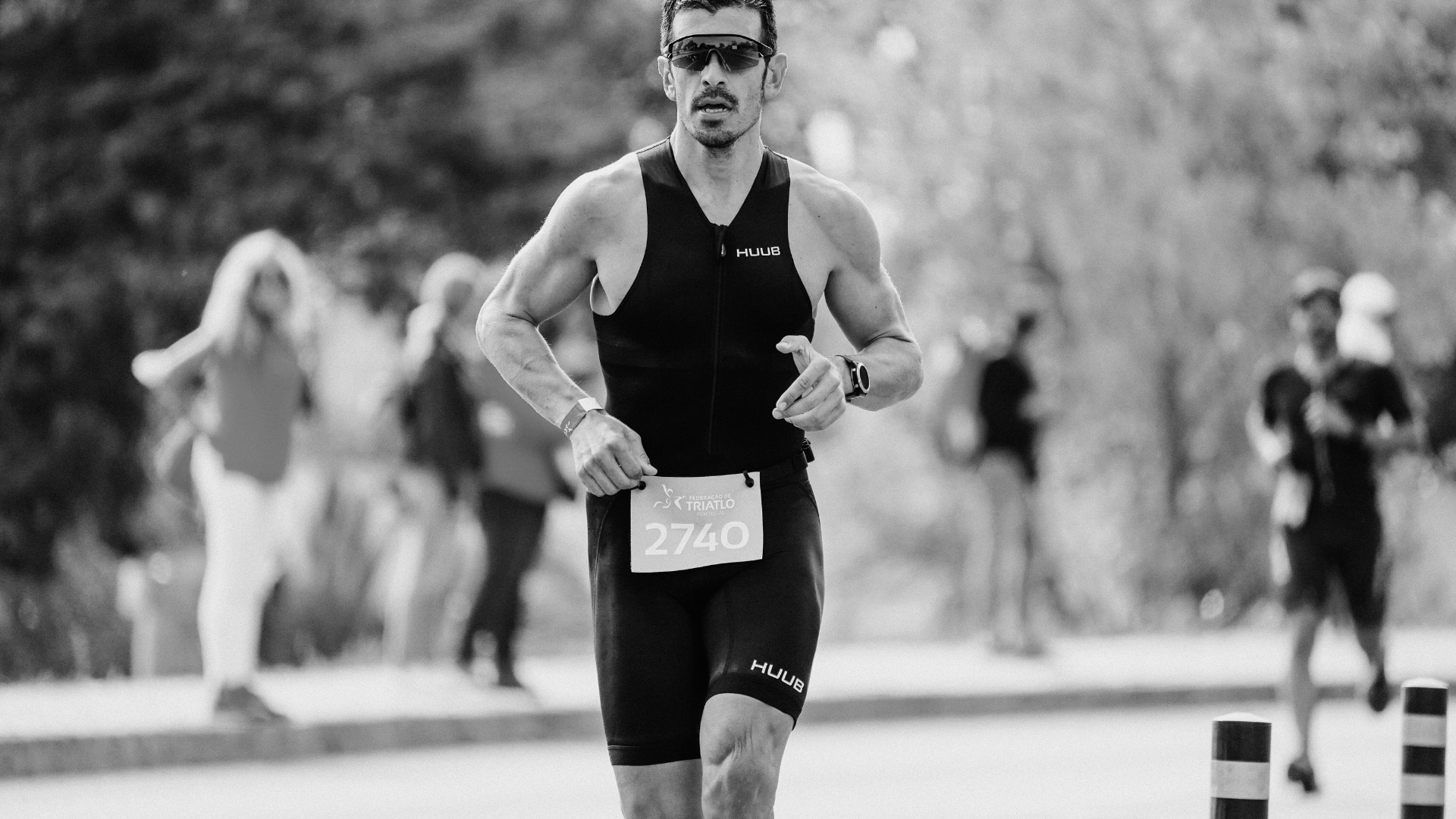 A determined triathlete running in a race, illustrating the role of fasted cardio in endurance training and fat metabolism.