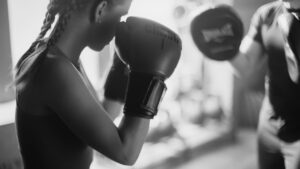 Conditioning a fighter in the gym while holding pads is key when conditioning and building strength