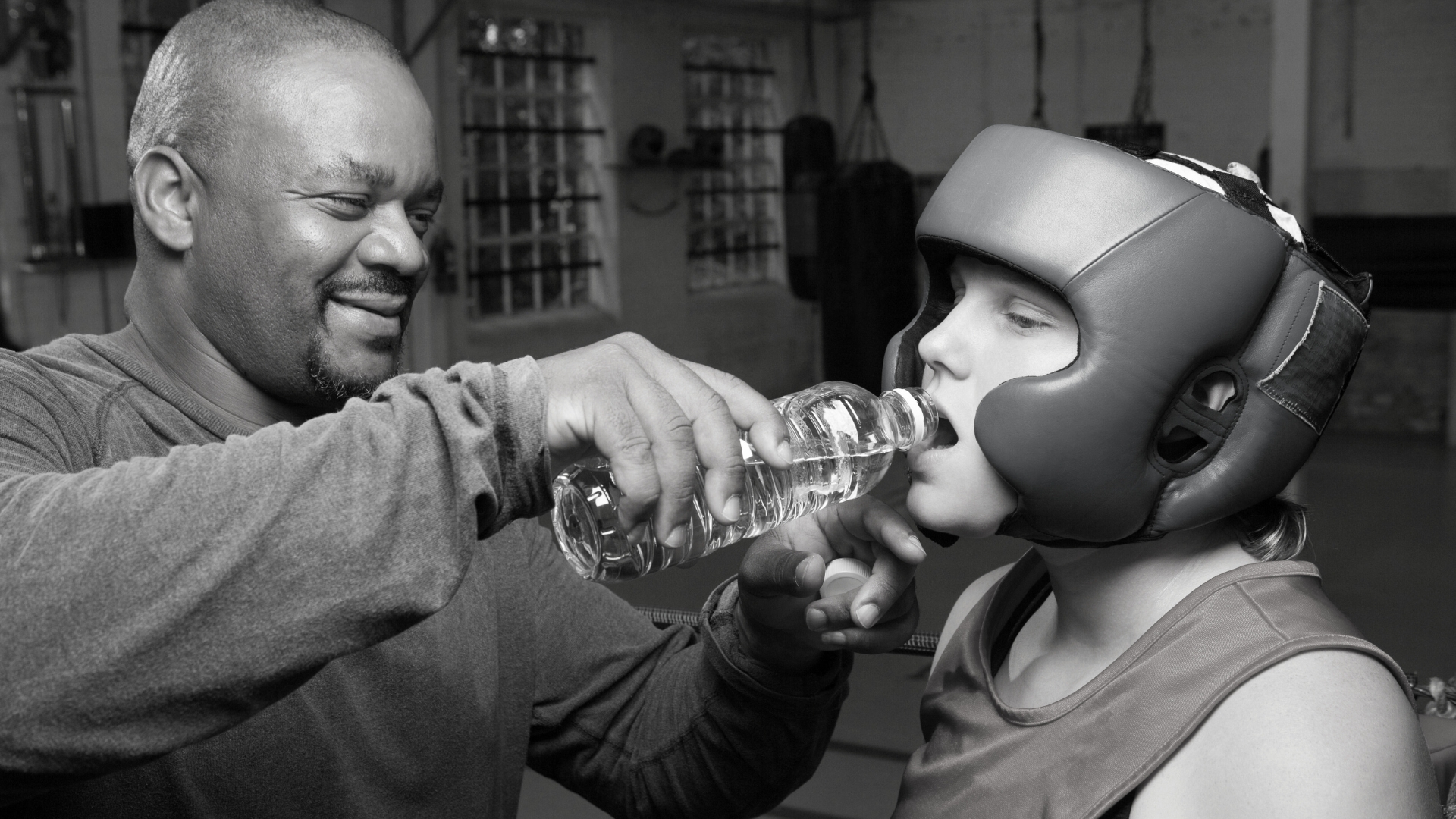 Essential hydration break during a boxing training session.