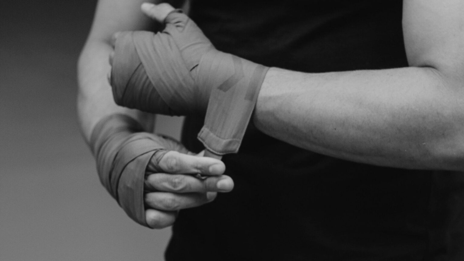 Wrapping a fighters hands before a hard training session after their nutrition helps performance gains.