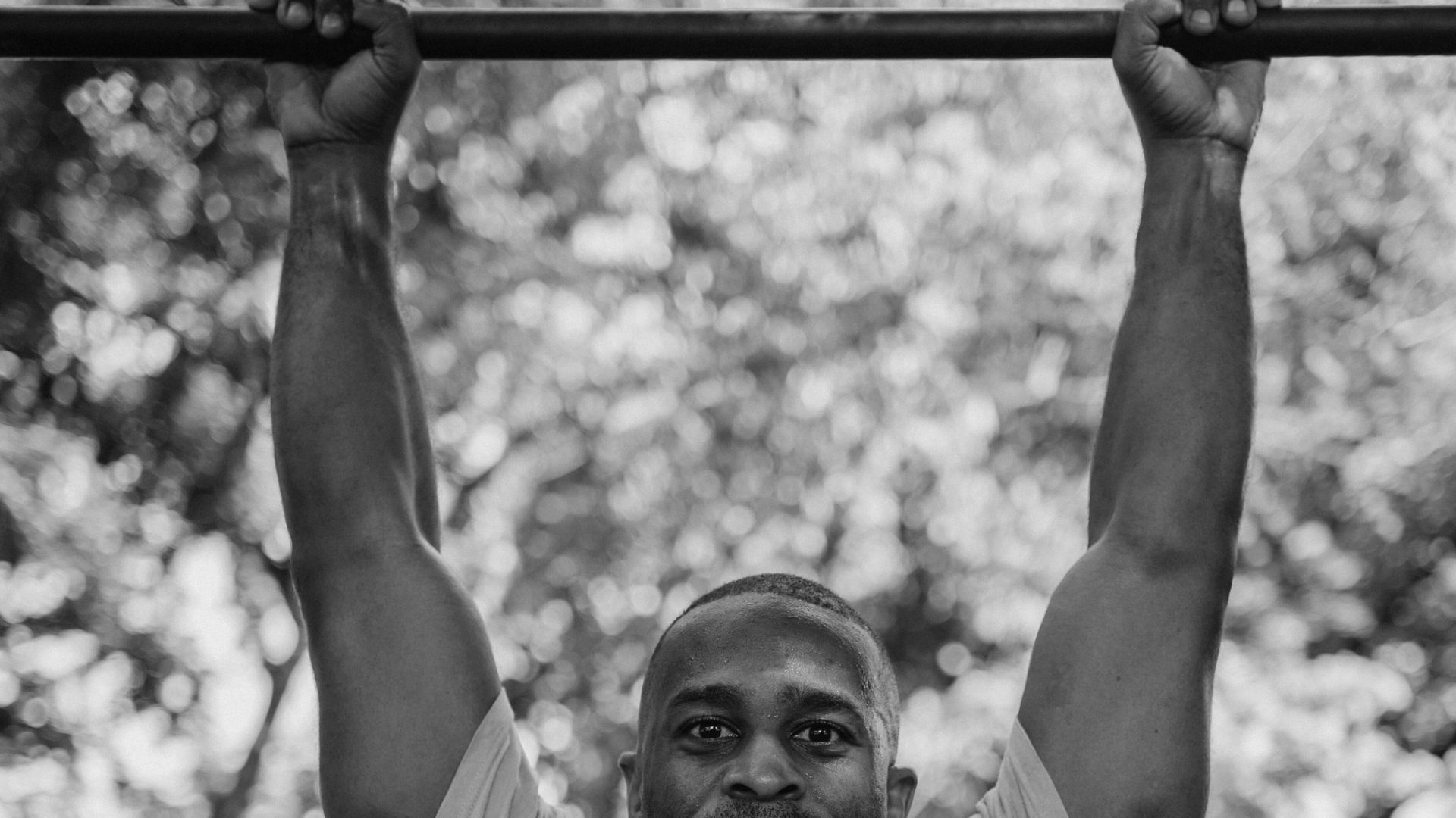 hanging from pull-up bar to build grip endurance and support grip strength